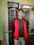 Michael Safyan standing in front of an old data center rack at Google